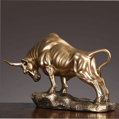 Modern gold and silver decorbites bull sculpture with golden metallic bull figurine on textured rocky base for office decor