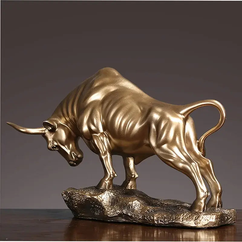 Modern gold and silver decorbites bull sculpture with golden metallic bull figurine on textured rocky base for office decor
