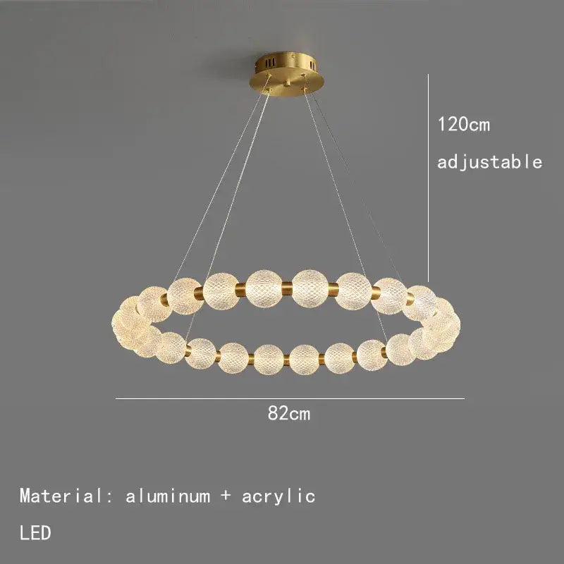 Modern gold and white acrylic led chandelier featuring a gold-toned double-ring frame with textured spheres decorbites acrylic led