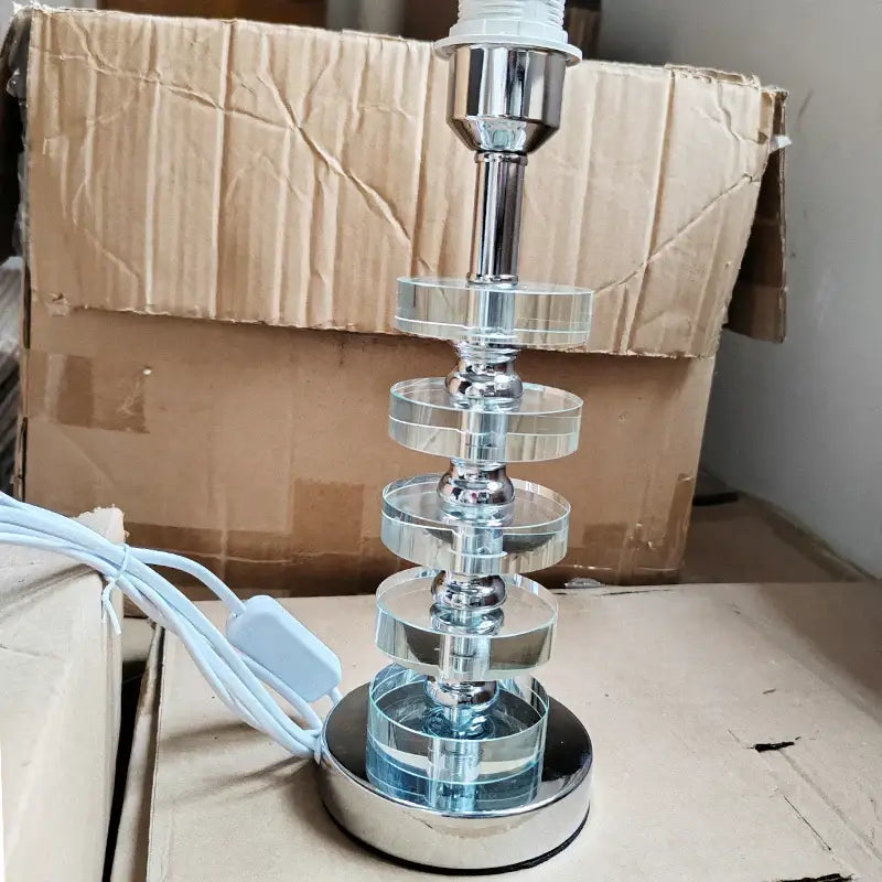 Modern gold and white crystal table lamp featuring a chrome-finished base with stacked clear acrylic discs for decorbites crystal table decor