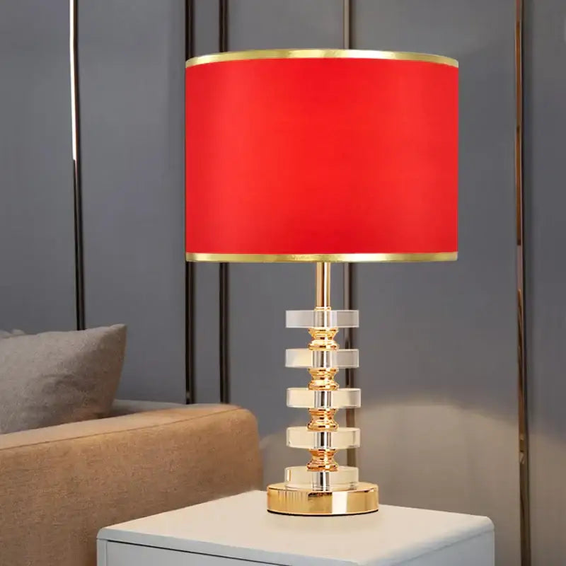 Modern gold and white crystal table lamp with a vibrant red fabric shade and tiered clear crystal base for bedroom decorbites crystal table lamp