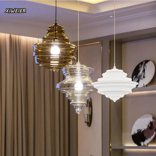 Modern gold and white decorbites glass chandelier featuring three tiered glass pendant lights for dining room use