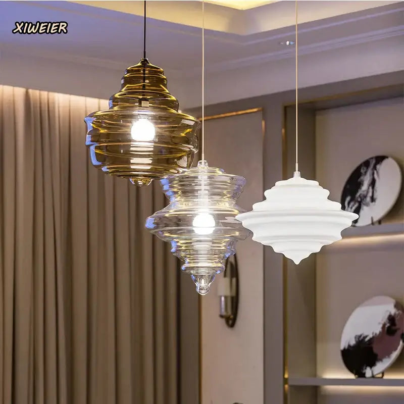 Modern gold and white decorbites glass chandelier featuring three tiered glass pendant lights for dining room use