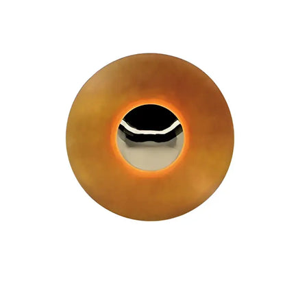 Modern gold and white led ufo wall sconce with amber plastic button and silver trim for bedside bedroom decor