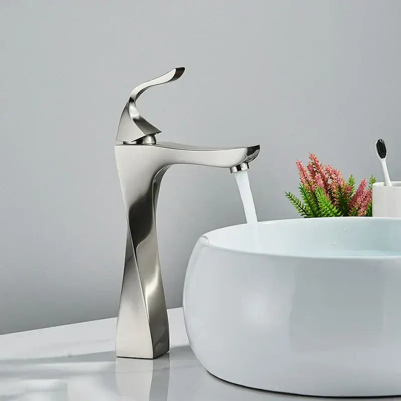 Modern gold angular basin faucet with a sleek brushed nickel twisted design and curved spout decorbites black bronze
