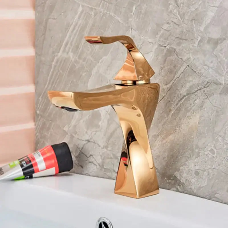 Modern gold angular basin faucet with sleek polished metallic finish ideal for bathroom fixture decorbites black bronze enthusiasts