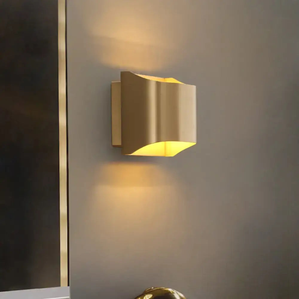 Modern gold angular led wall sconce with sleek design and warm yellow light for living room lighting fixture