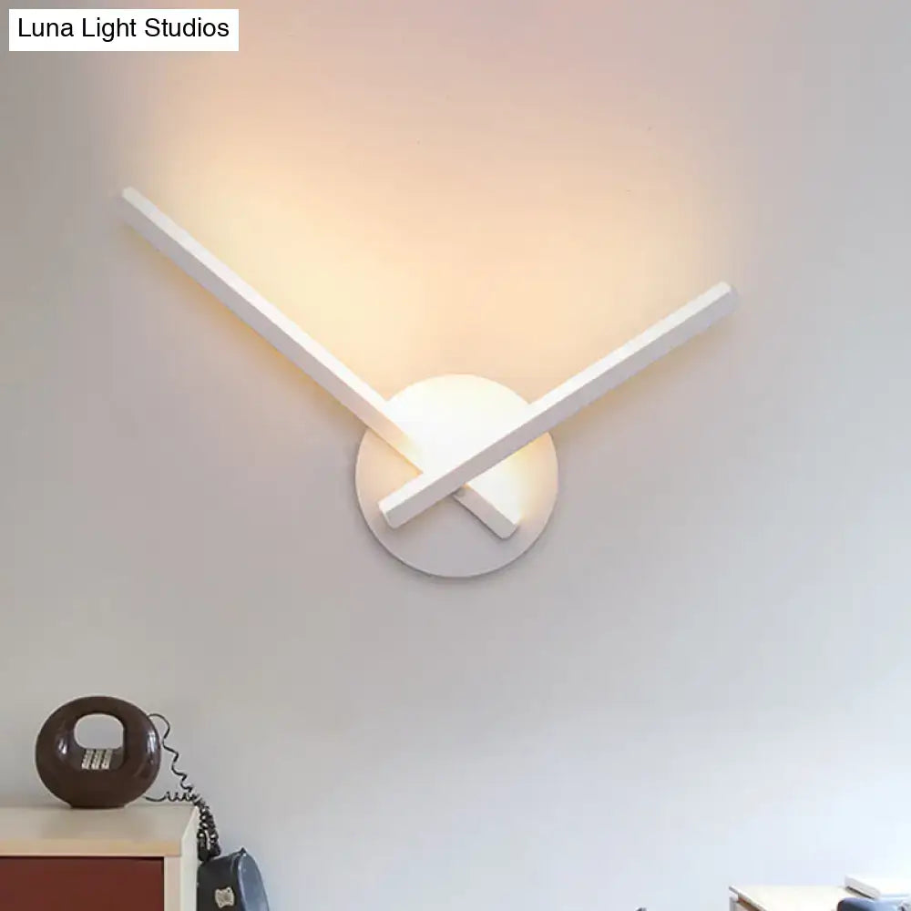 Modern gold angular wall lamp with minimalist white wall sconce design and warm white diffused lighting for bedroom