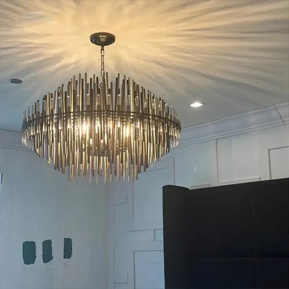 Modern gold and black brass pendant light with circular frame and translucent glass rods for dining room decorbites brass pendant