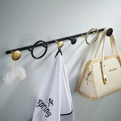 Black and gold brass towel hook set with round and circular hooks for modern bathroom wall hanging