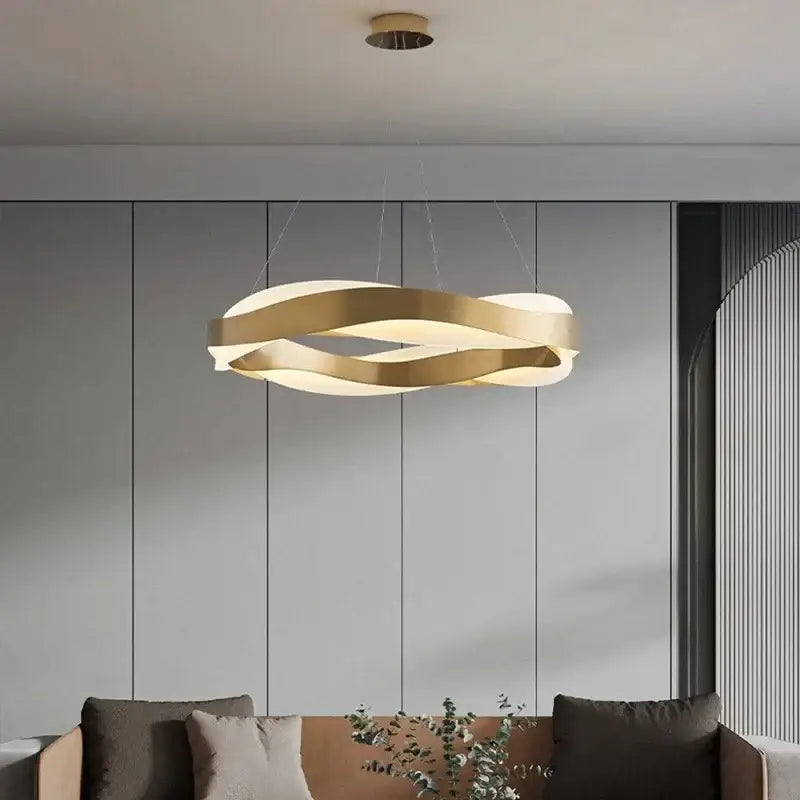 Modern gold and black circle pendant light with elegant black intertwined rings for stylish living room chandelier