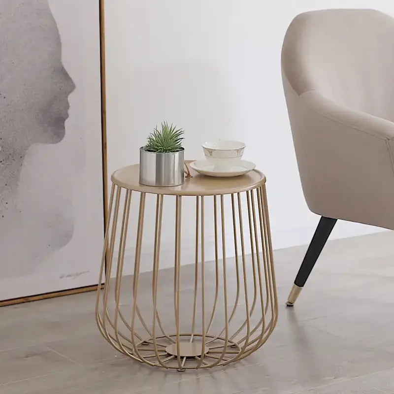 Modern gold coffee table with wireframe metal base and round wooden top ideal for decorbites gold pumpkin decor