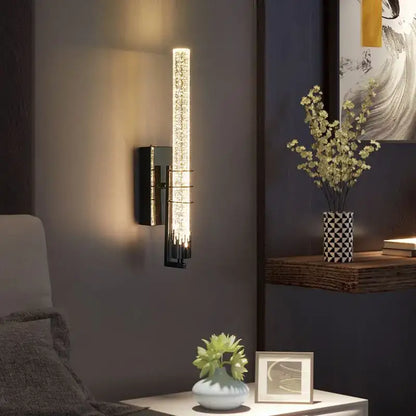 Modern gold and black crystal led wall sconce with vertical illuminated glass tube featuring embedded crystal elements for decorbites crystal led decor