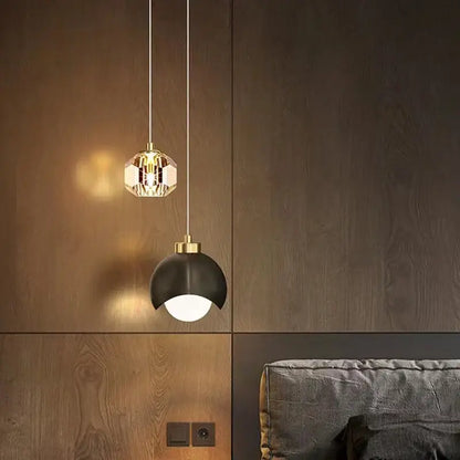 Two modern pendant lights with gold crystal and black dome color options feature bulbs included for dining room use