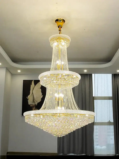 Modern gold and black pendant light with metal finish and cascading clear crystals for dining room staircase lighting