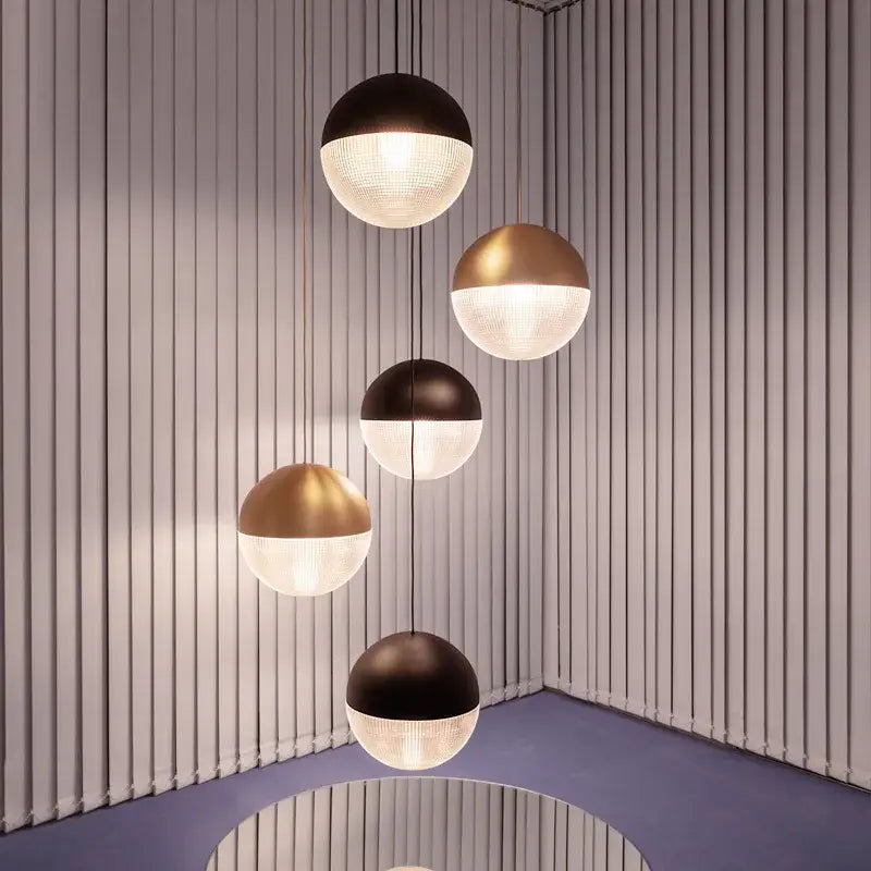 Modern gold and black glass ball led pendant light with matte black and brushed gold tops for bedroom decorbites decor