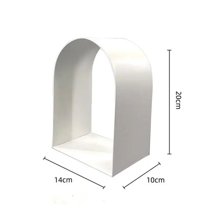 White arched shelf with smooth minimalist design complements modern gold and black decorbites golden arches metal sculpture