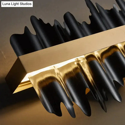 Black and gold metallic decorbites™ irene led chandelier lighting with sculpted wave-like arms for dining room use