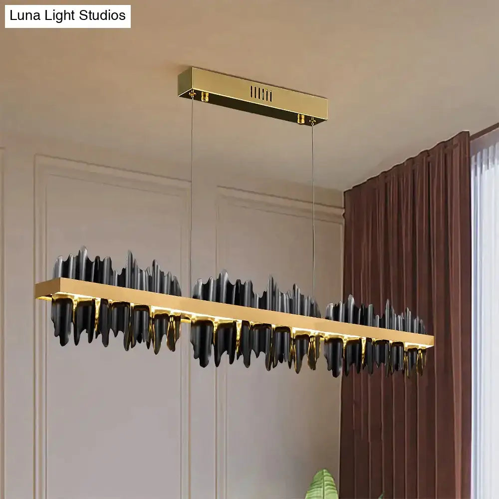 Modern gold and black led chandelier lighting with sleek mountain-like design for dining room by DecorBites Irene Iceberg