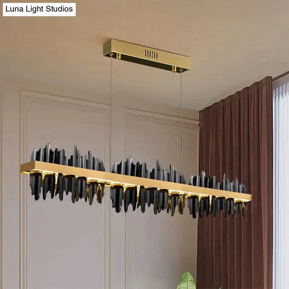 Modern gold and black led chandelier lighting with sleek mountain-like design for dining room by DecorBites Irene Iceberg