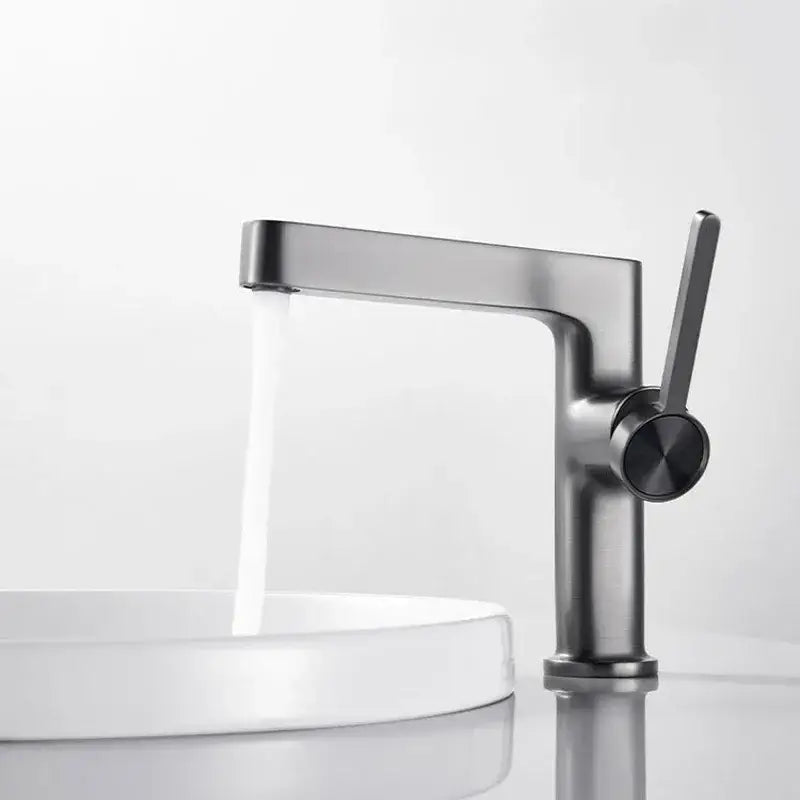 Modern gold and black decorbites basin faucet with matte black finish and sleek single lever handle for bathroom use