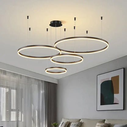 Modern black circular led pendant light with warm glowing rings for contemporary interiors and dining room focal point