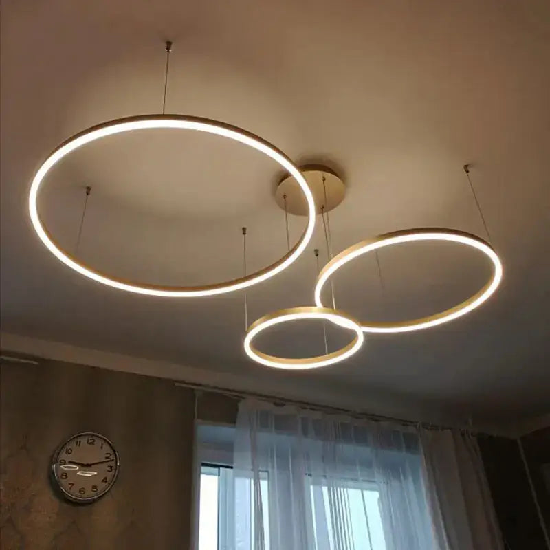 Modern gold and black minimalist ring pendant light with warm white led for contemporary interiors and focal point use