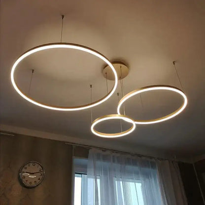 Modern gold and black minimalist ring pendant light with warm white led for contemporary interiors and focal point use