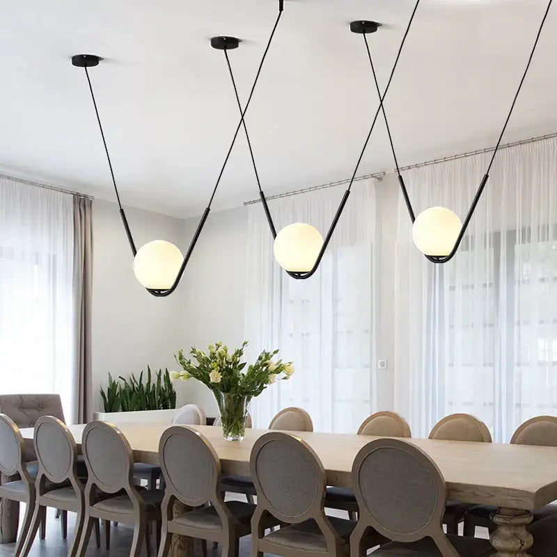 Modern gold and black pendant light dining room spherical glass trio with black metal and frosted glass shades by decorbites golden black perle