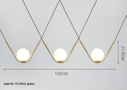 Modern gold and black pendant light with three frosted glass globes and black cords from decorbites golden black perle collection