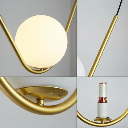 Modern gold and black pendant light with frosted glass globe and sleek metal frame for dining room decorbites golden black perle