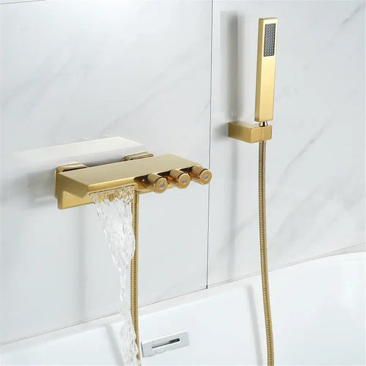 Modern gold black shower set featuring a gold-toned tub mixer faucet with three handles and handheld showerhead