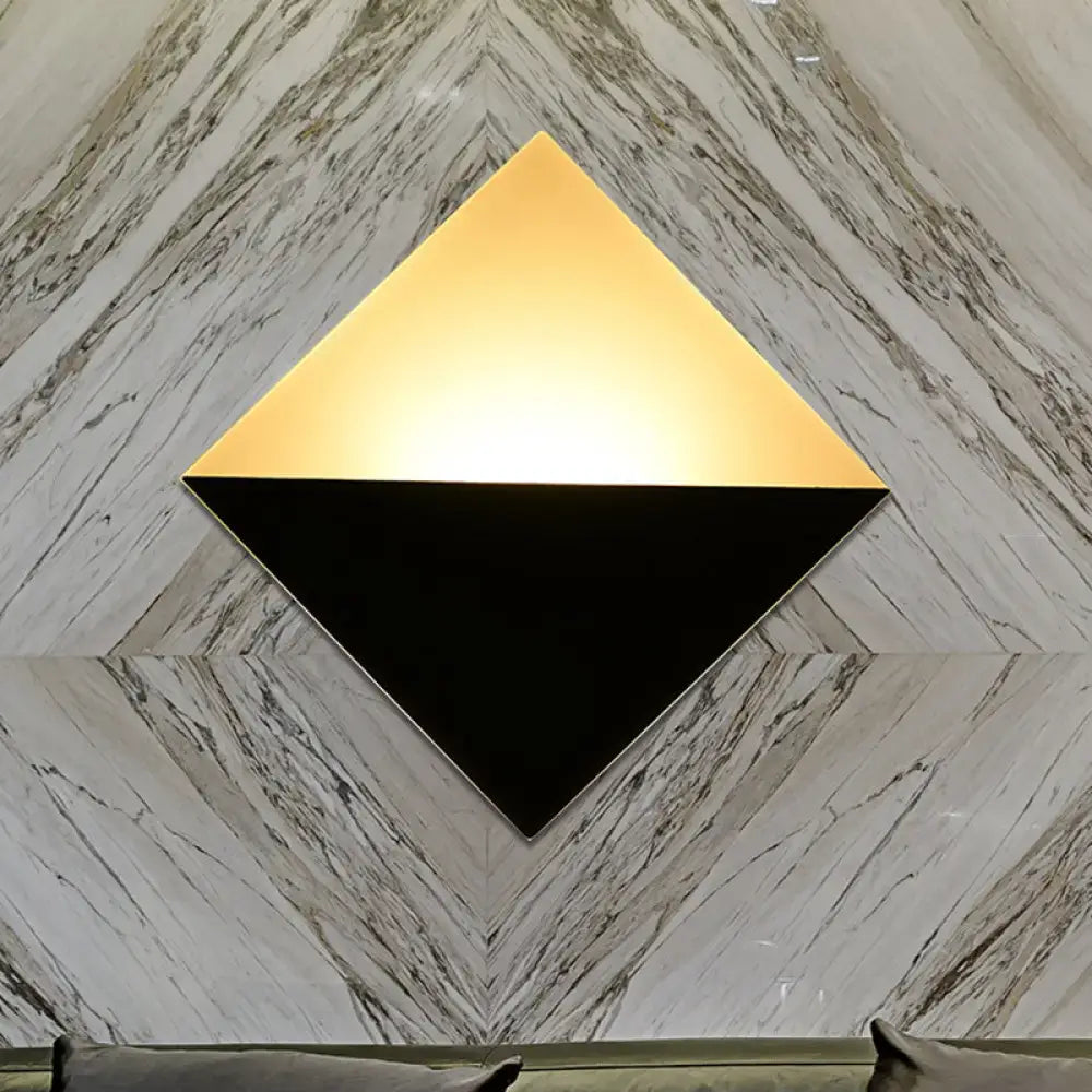 Modern gold and black square wall sconce with a two-tone design and fixture height for bedroom led lighting