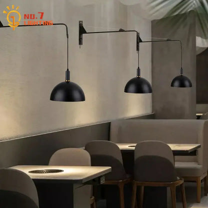 Black dome-shaped pendant wall lamp with sleek metal arms featuring decorbites gold black swing arm design