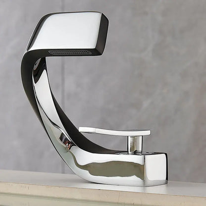 Modern gold and black waterfall basin faucet with chrome finish sleek curved design and rectangular spout for bathroom use