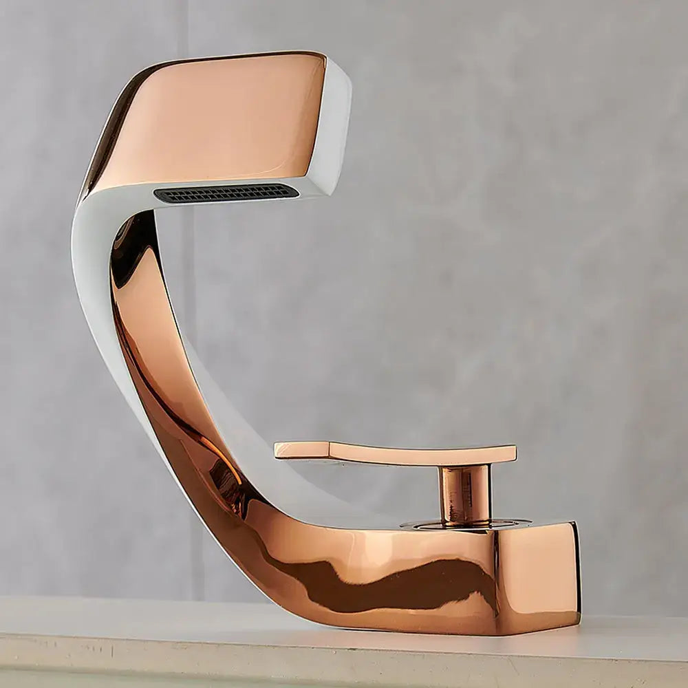 Modern rose gold basin faucet with sleek curved design and integrated spray head for bathroom use