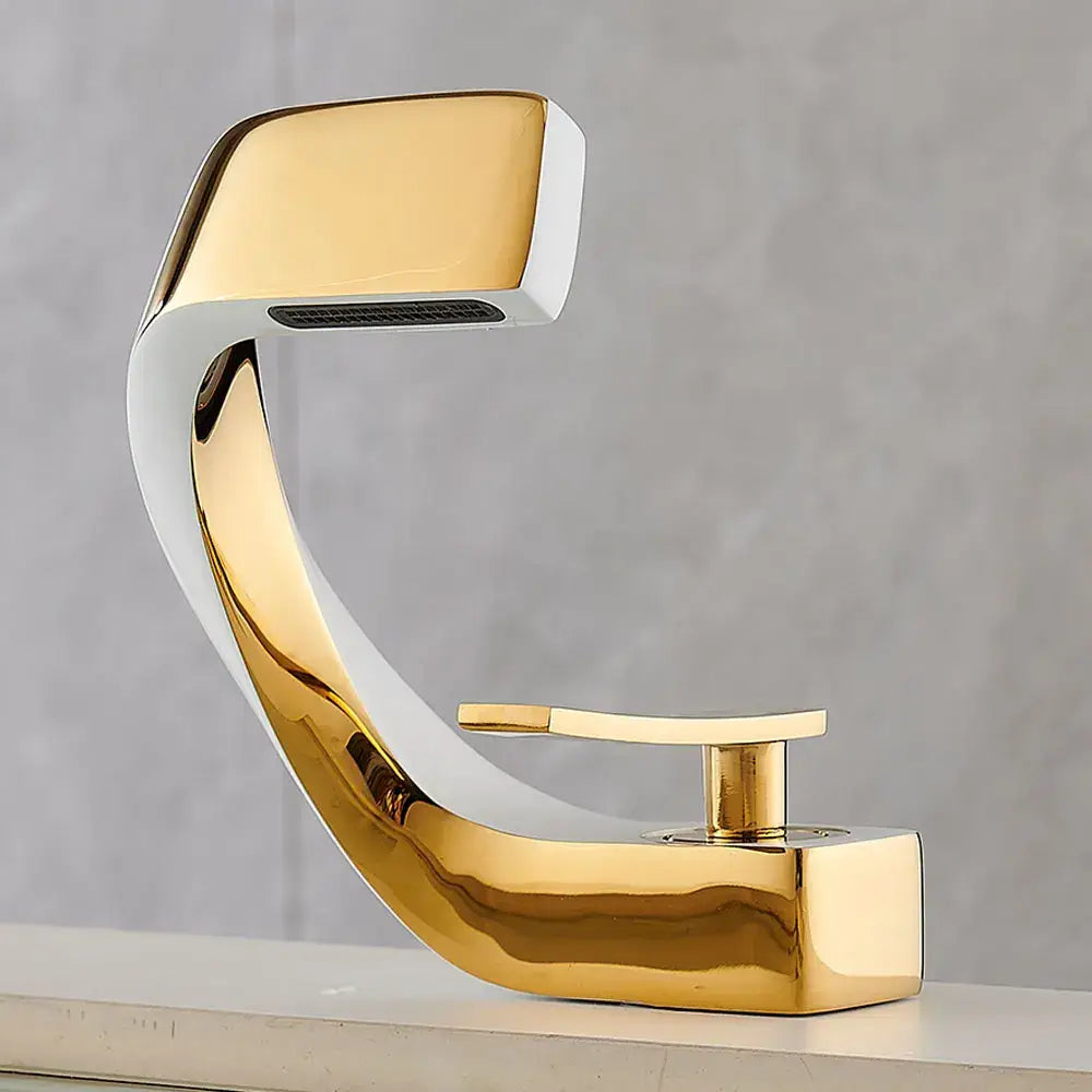 Modern gold and white basin faucet with sleek curved design for bathroom waterfall basin faucet fixture