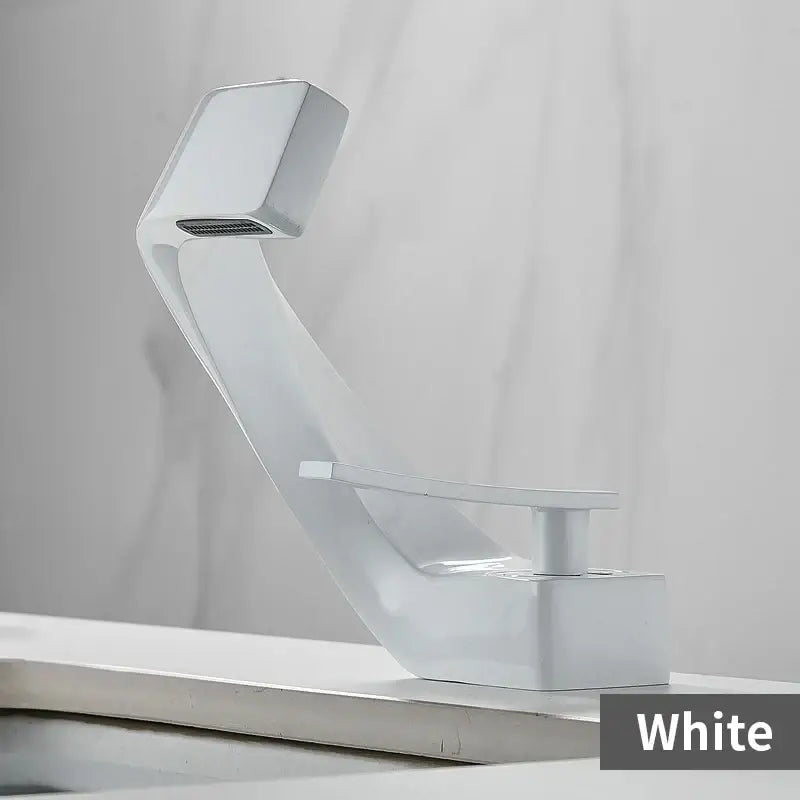 White modern basin faucet with sleek curved design and square spout for gold and black waterfall bathroom fixture