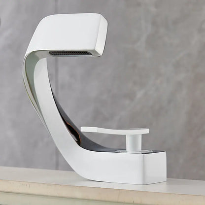 Modern white and chrome basin faucet with sleek curved design for contemporary bathroom fixture use