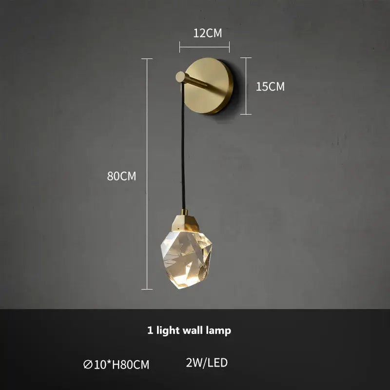 A modern gold-toned wall lamp with faceted crystal pendant and black cord for dimmable crystal chandelier decorbites copper led