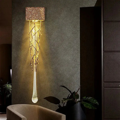 A modern gold branch art cage crystal chandelier with woven textured top and teardrop glass pendant for dining room decorbites branch art