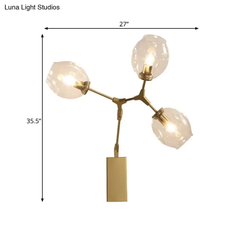 Modern gold branch wall lamp with three frosted glass globe shades for living room lighting and decor
