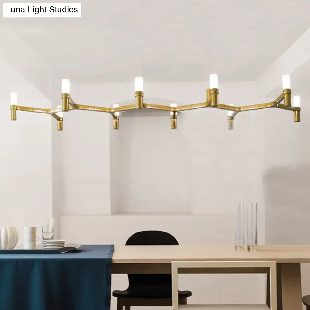 Gold-toned metallic branch island pendant light with bamboo-inspired design and frosted glass fixtures for dining room