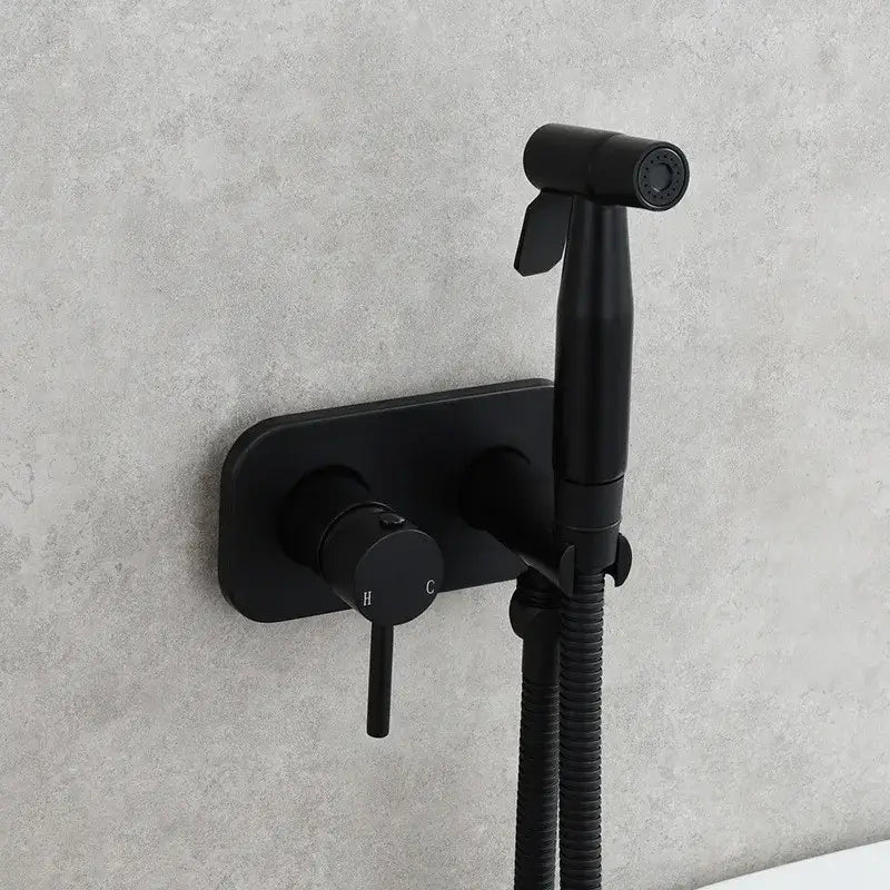 Black matte finish wall-mounted brass bidet sprayer with sleek modern design and flexible hose decorbites brass bidet