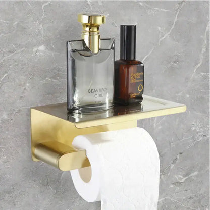 Modern gold brushed bathroom accessories set featuring a gold-toned shelf with integrated toilet paper holder decorbites bathroom