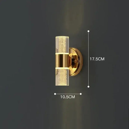 Modern gold vanity light from decorbites featuring a gold-toned wall sconce with textured bubble glass shade and metallic bands