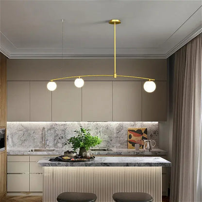 Modern gold bubble iron chandelier kitchen arc pendant light with three spherical bulbs and sleek curved arm by decorbites bubble iron