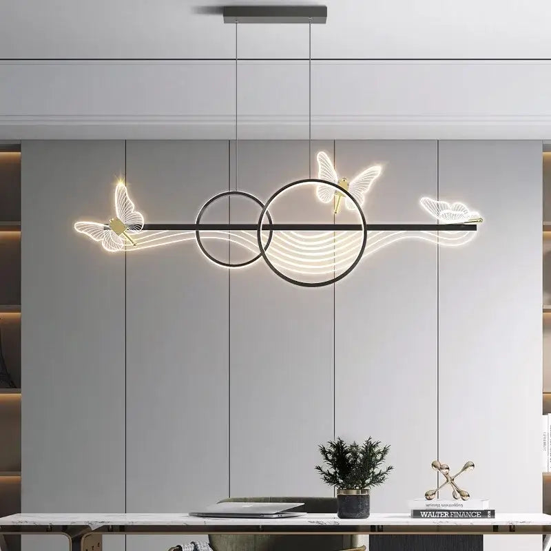 Modern black metal pendant light with glowing white butterfly and circular led accents decorbites butterfly chandelier