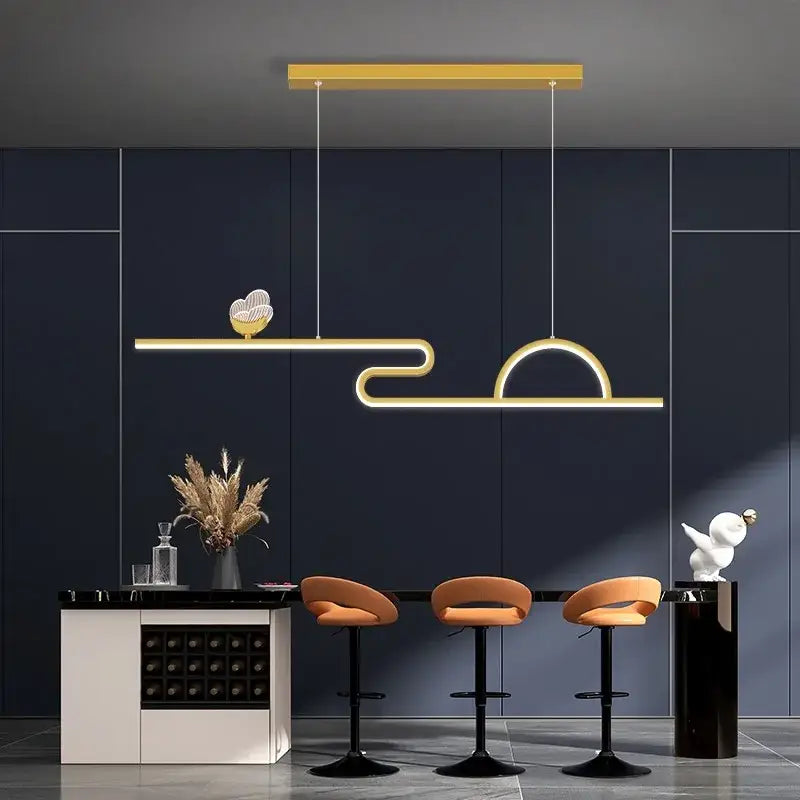 Modern gold-toned led butterfly chandelier pendant lamp with sleek curved design and heart accent for dining room decorbites