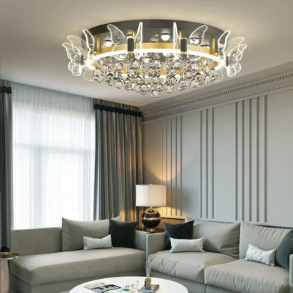 Modern gold butterfly crystal ceiling light featuring intricate butterfly wing designs and dangling crystal droplets for bedroom decorbites elegant butterfly ceiling lamp